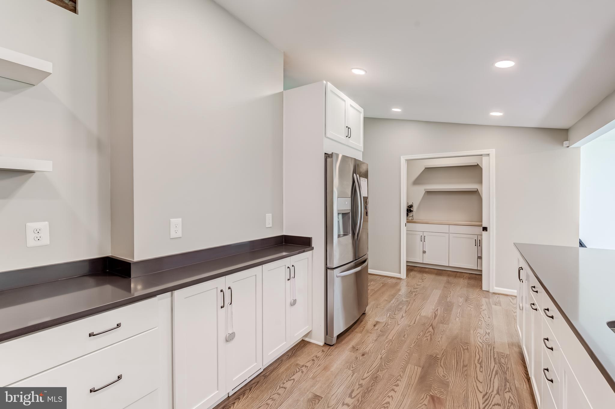 11926 Appling Valley Road Fairfax, VA 22030 - Photo 20 of 60 a kitchen with granite countertop white cabinets and stainless steel appliances