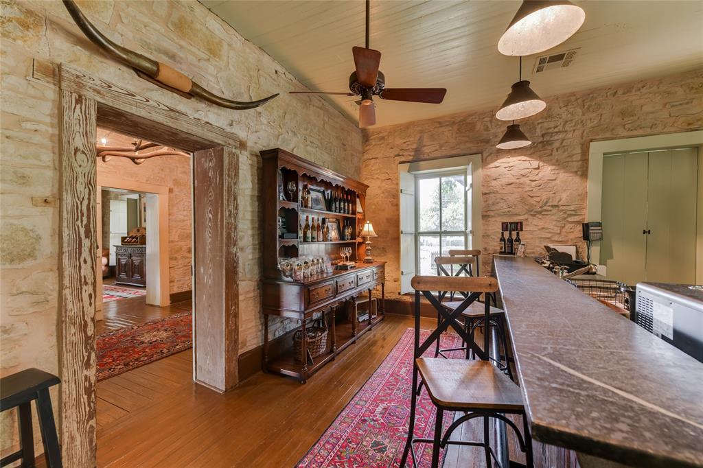 802 South Austin Street Comanche, TX 76442 - Photo 12 of 20 a view of a livingroom with furniture and hardwood floor