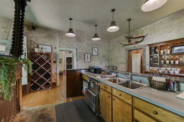 a kitchen that has a lot of cabinets in it