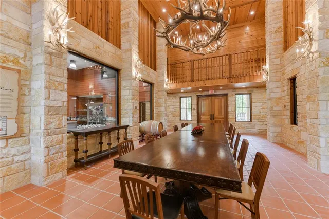 a view of a patio with table and chairs and potted plants