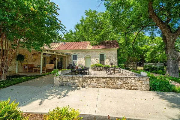 a view of house with yard outdoor seating and entertaining space