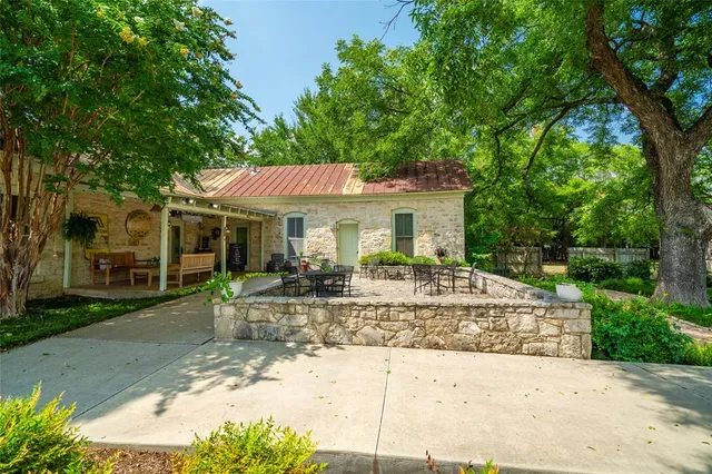 a view of house with yard outdoor seating and entertaining space