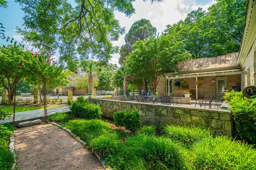 802 South Austin Street Comanche, TX 76442 - Photo 6 of 20 a view of a house with a yard and sitting area