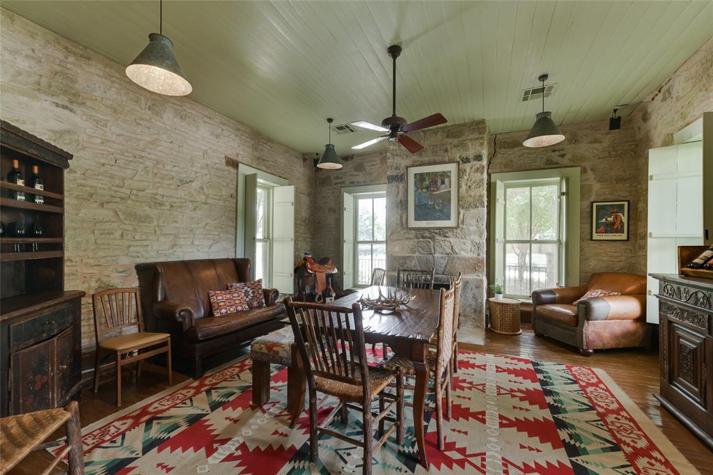 802 South Austin Street Comanche, TX 76442 - Photo 10 of 20 a living room with furniture and a chandelier
