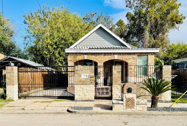 a front view of a house with garden