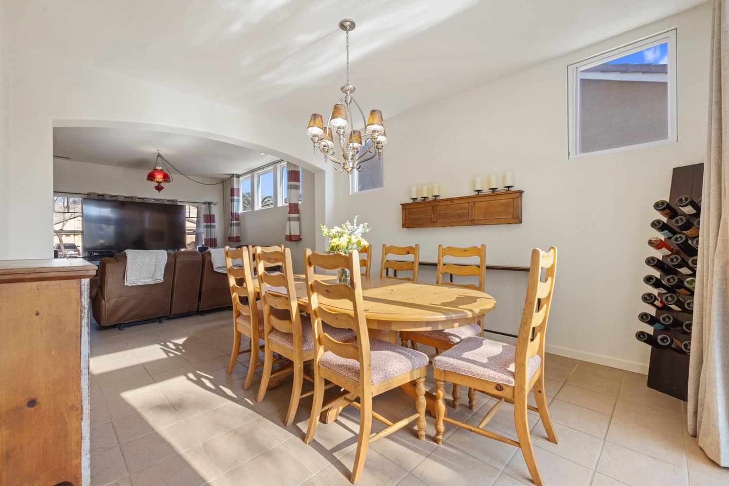 2730 Explorer Way Turlock, CA 95382 - Photo 12 of 64 a dining room with furniture a chandelier and window