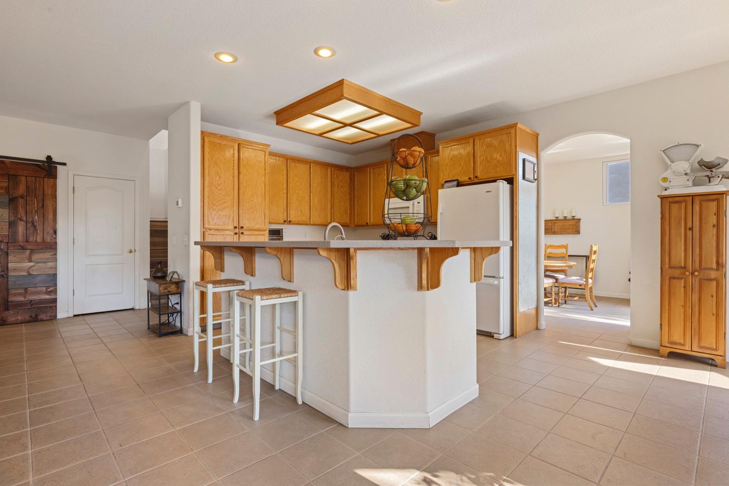 2730 Explorer Way Turlock, CA 95382 - Photo 19 of 64 a view of kitchen with furniture and a window