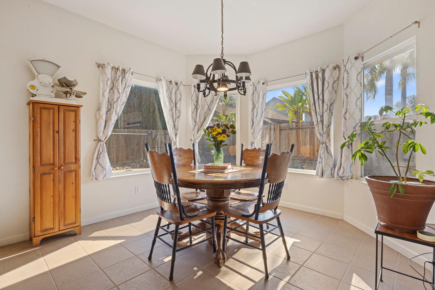 2730 Explorer Way Turlock, CA 95382 - Photo 20 of 64 a view of a dining room with furniture window and outside view