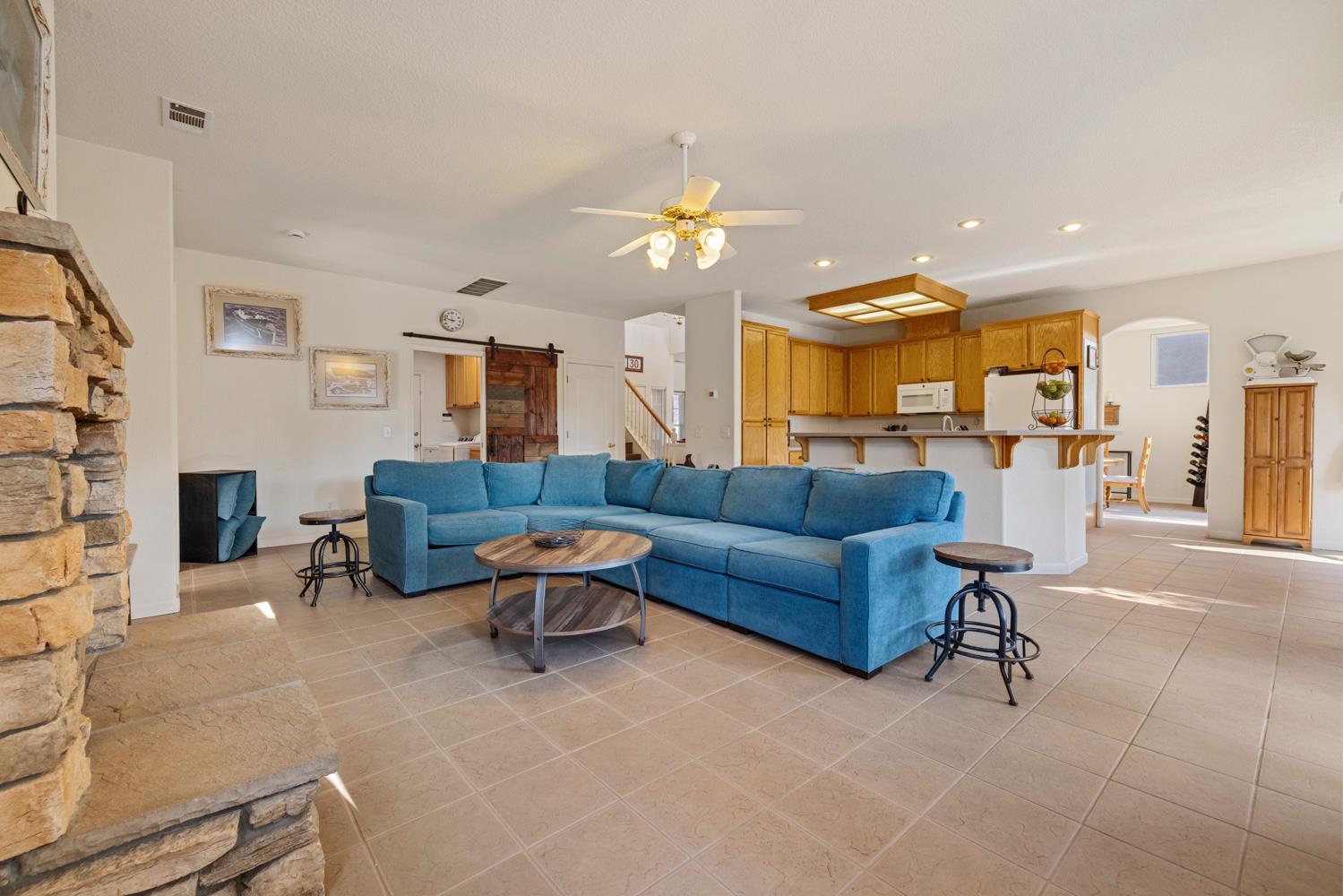 2730 Explorer Way Turlock, CA 95382 - Photo 23 of 64 a living room with furniture and a fireplace