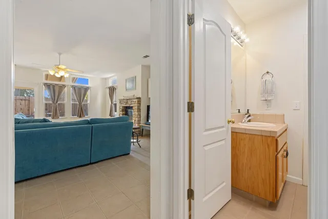 a bed room with a bed mirror and a window