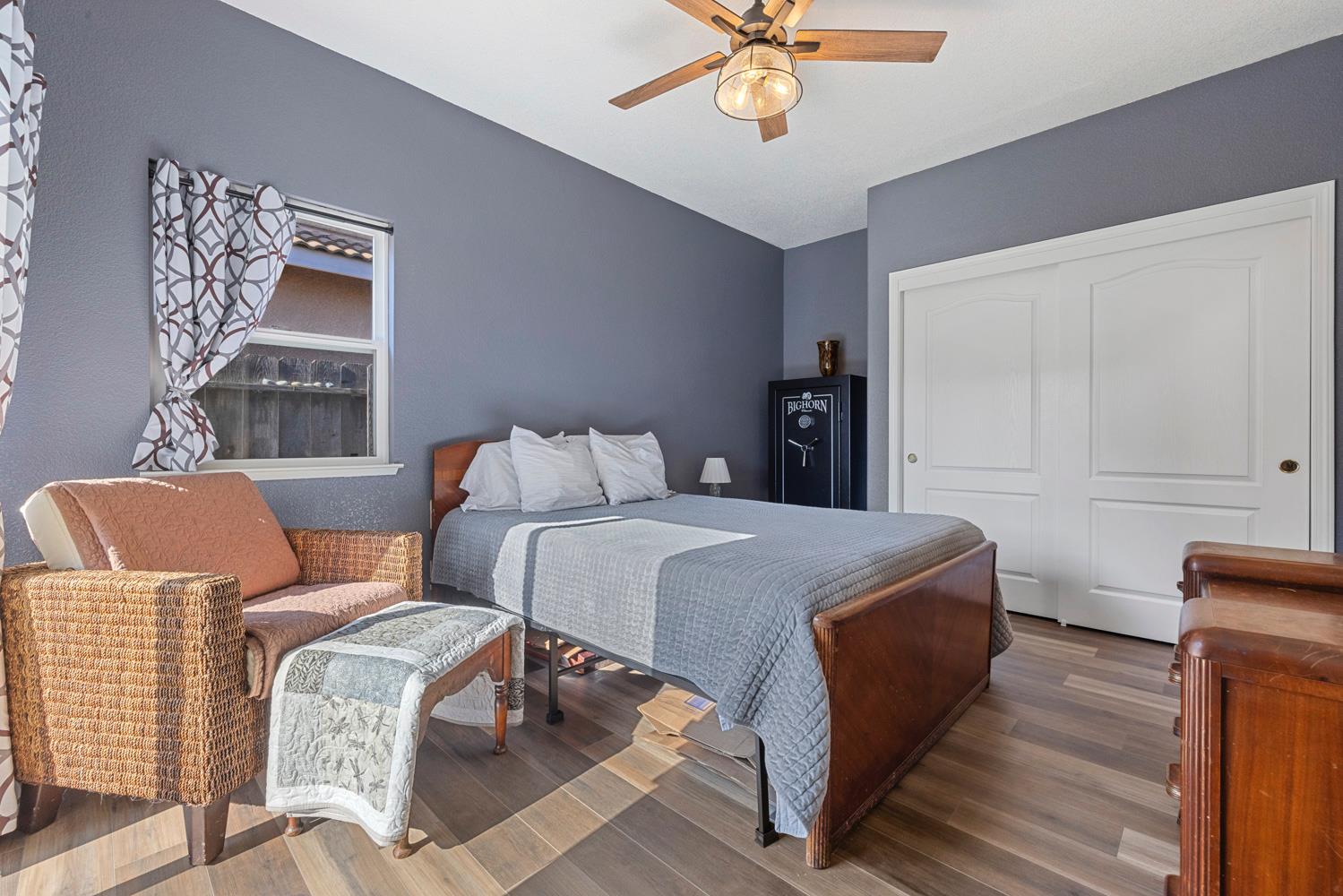 2730 Explorer Way Turlock, CA 95382 - Photo 30 of 64 a bedroom with a bed and flowerpot