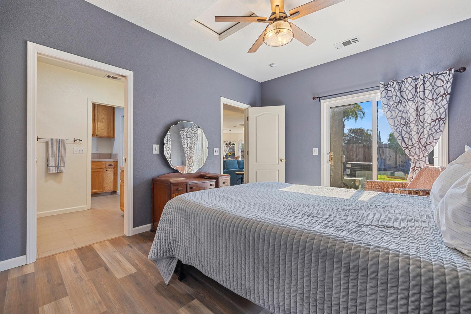 2730 Explorer Way Turlock, CA 95382 - Photo 31 of 64 a bed room with a bed mirror and a window