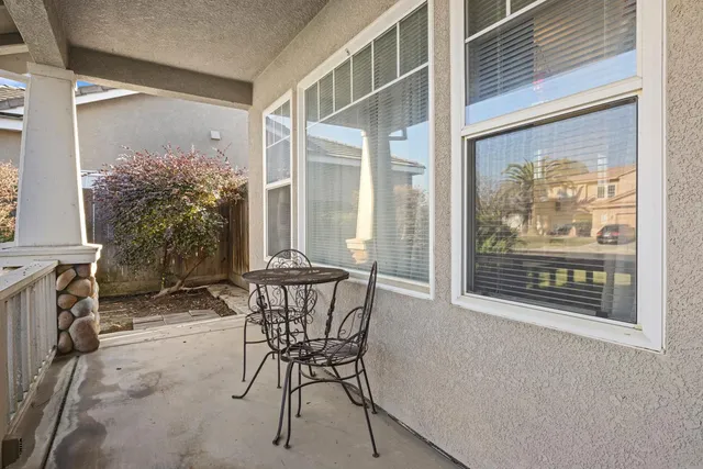 a view of a room that has a table and chair in it