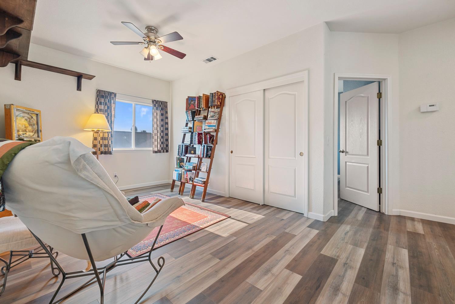 2730 Explorer Way Turlock, CA 95382 - Photo 42 of 64 a view of a workspace with furniture and a ceiling fan