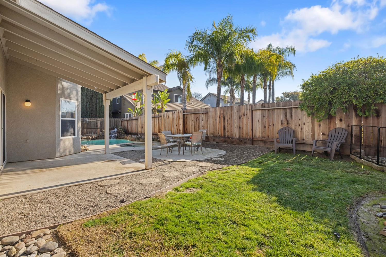 2730 Explorer Way Turlock, CA 95382 - Photo 51 of 64 a view of a backyard with palm trees