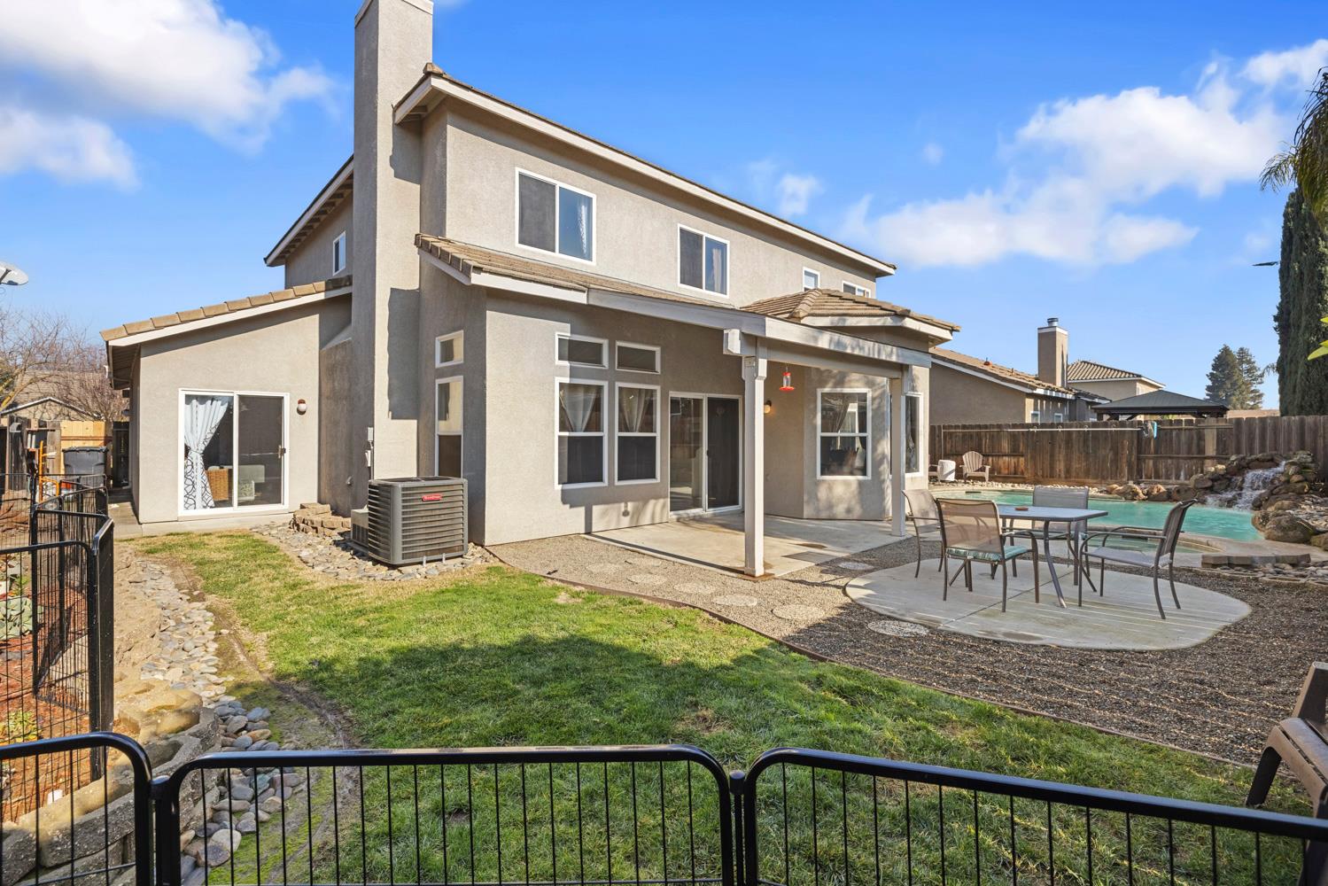 2730 Explorer Way Turlock, CA 95382 - Photo 52 of 64 a view of a house with backyard and sitting area