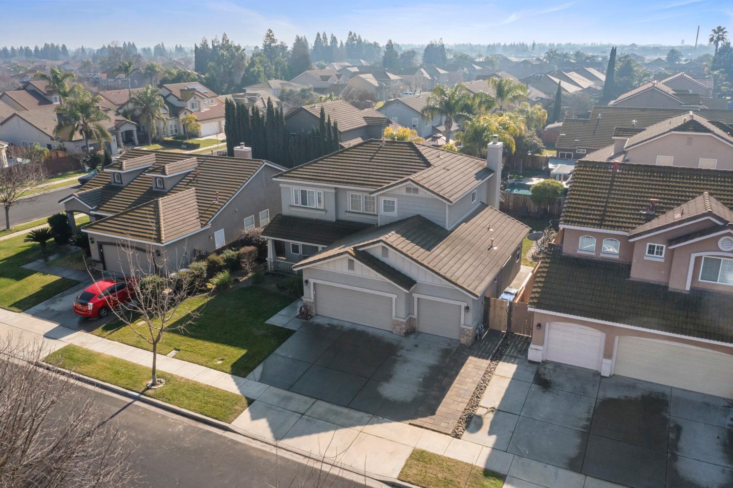 2730 Explorer Way Turlock, CA 95382 - Photo 57 of 64 an aerial view of a house with a garden