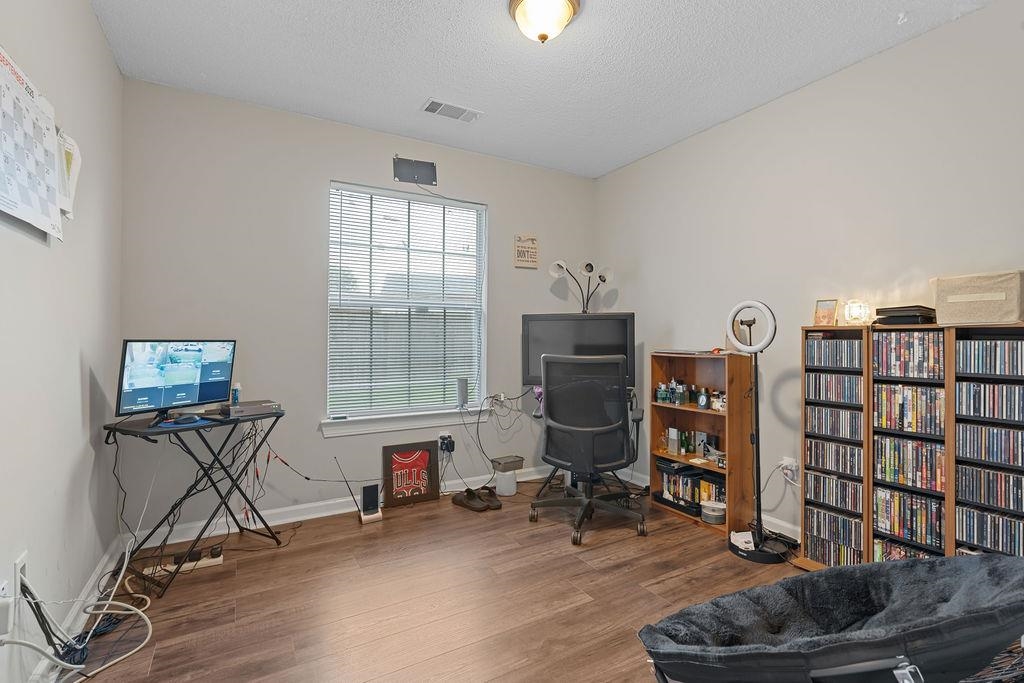 5340 Shady Ridge Cove Memphis, TN 38141 - Photo 15 of 22 Office area featuring wood finished floors and a textured ceiling