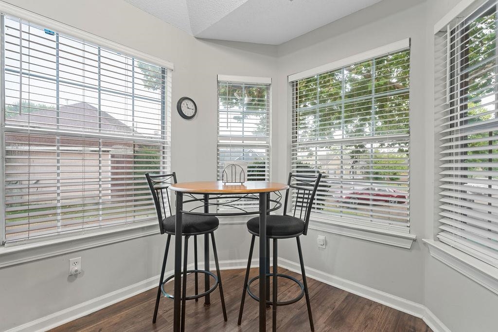 5340 Shady Ridge Cove Memphis, TN 38141 - Photo 10 of 22 Dining area featuring dark wood finished floors and baseboards
