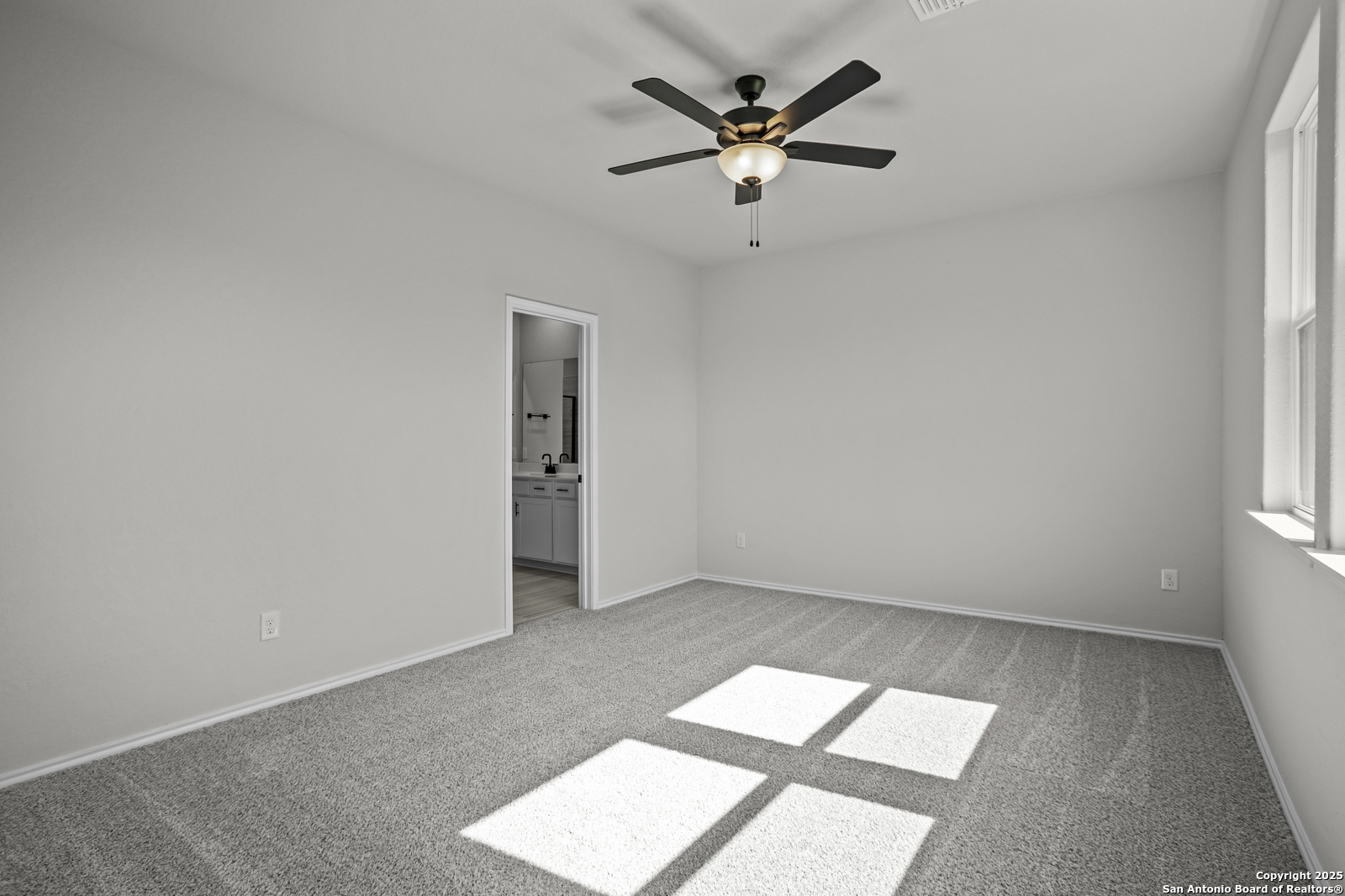 7420 Cremorne Converse, TX 78109 - Photo 14 of 40 an empty room with a window and a fan