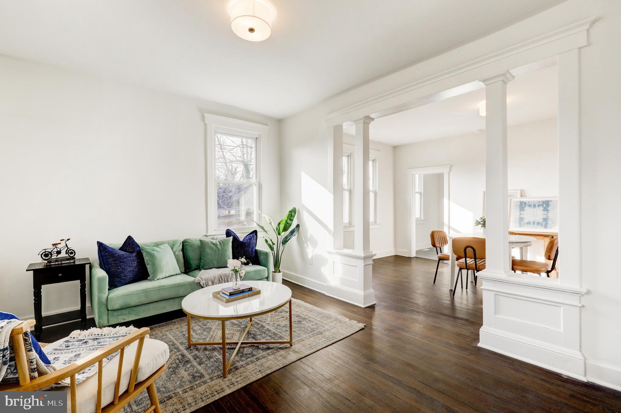7301 North Radcliffe Street Bristol, PA 19007 - Photo 2 of 43 a living room with furniture and wooden floor