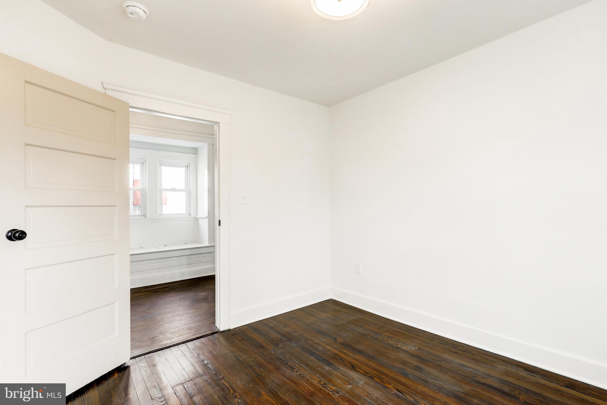 7301 North Radcliffe Street Bristol, PA 19007 - Photo 25 of 43 a view of wooden floor and windows in a room
