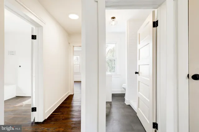 a view of a bathroom from a hallway