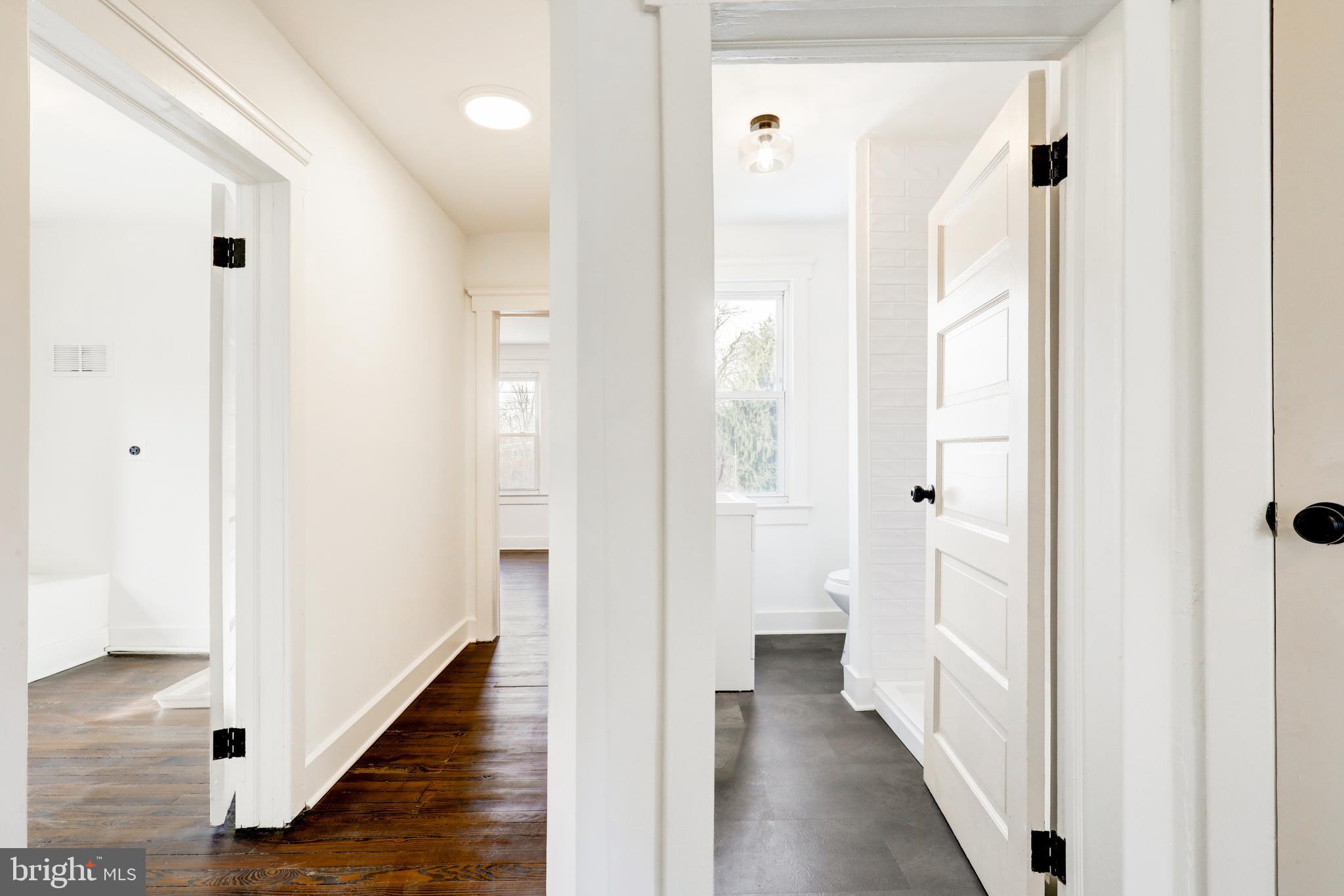 7301 North Radcliffe Street Bristol, PA 19007 - Photo 26 of 43 a view of a bathroom from a hallway