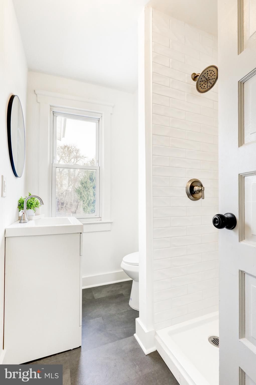 7301 North Radcliffe Street Bristol, PA 19007 - Photo 27 of 43 a bathroom with a sink a toilet and shower