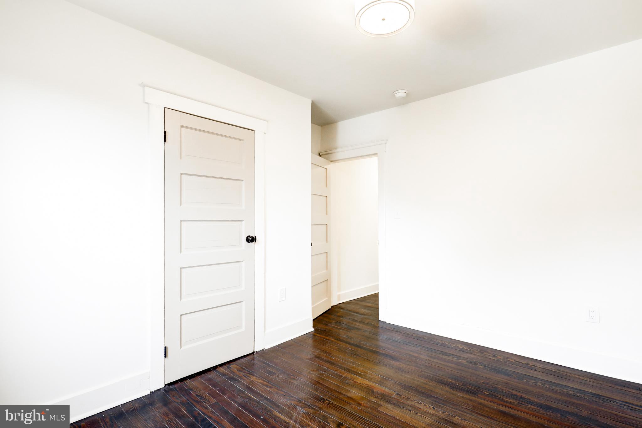 7301 North Radcliffe Street Bristol, PA 19007 - Photo 32 of 43 a view of an empty room with wooden floor
