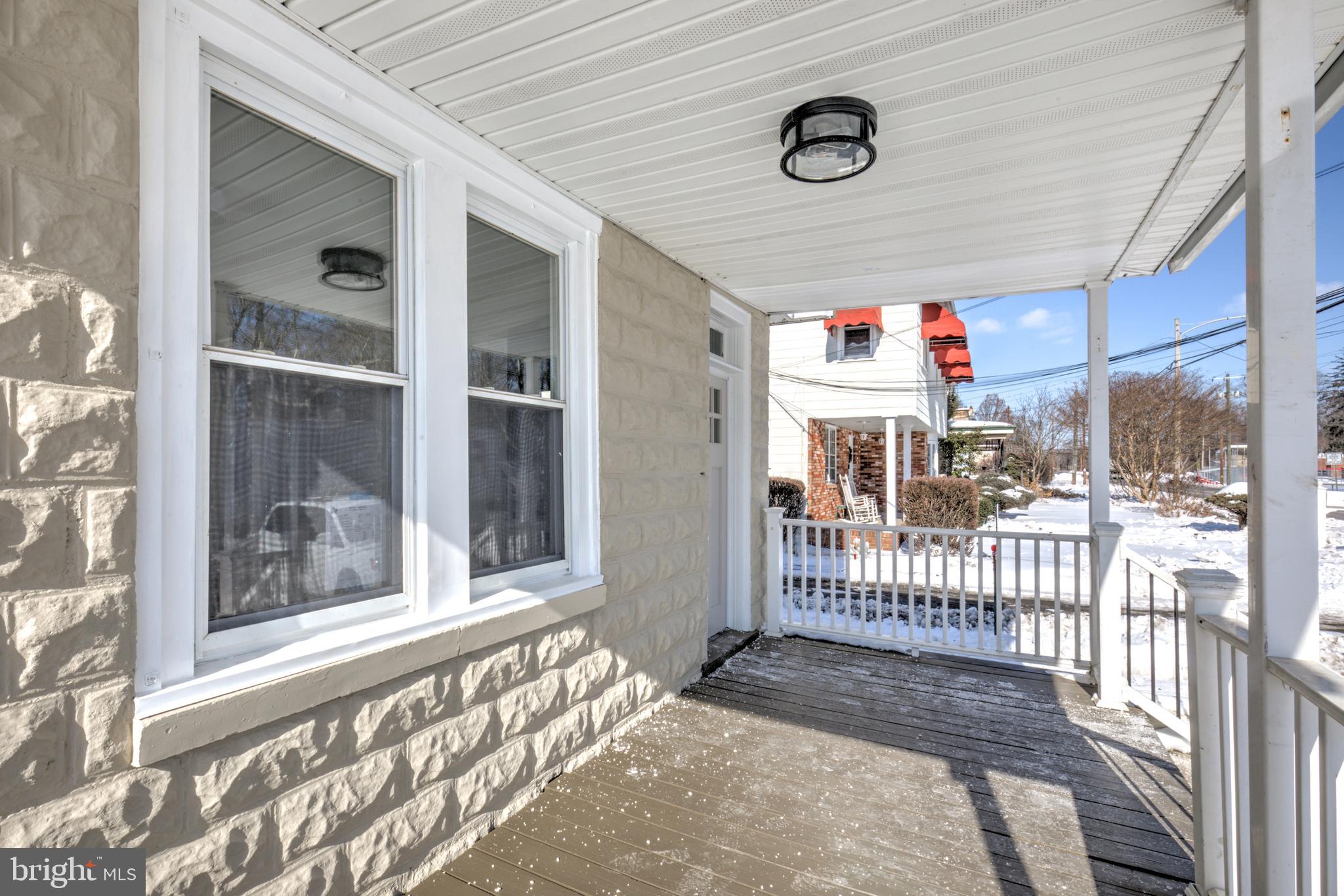 7301 North Radcliffe Street Bristol, PA 19007 - Photo 37 of 43 a front view of a house with a porch