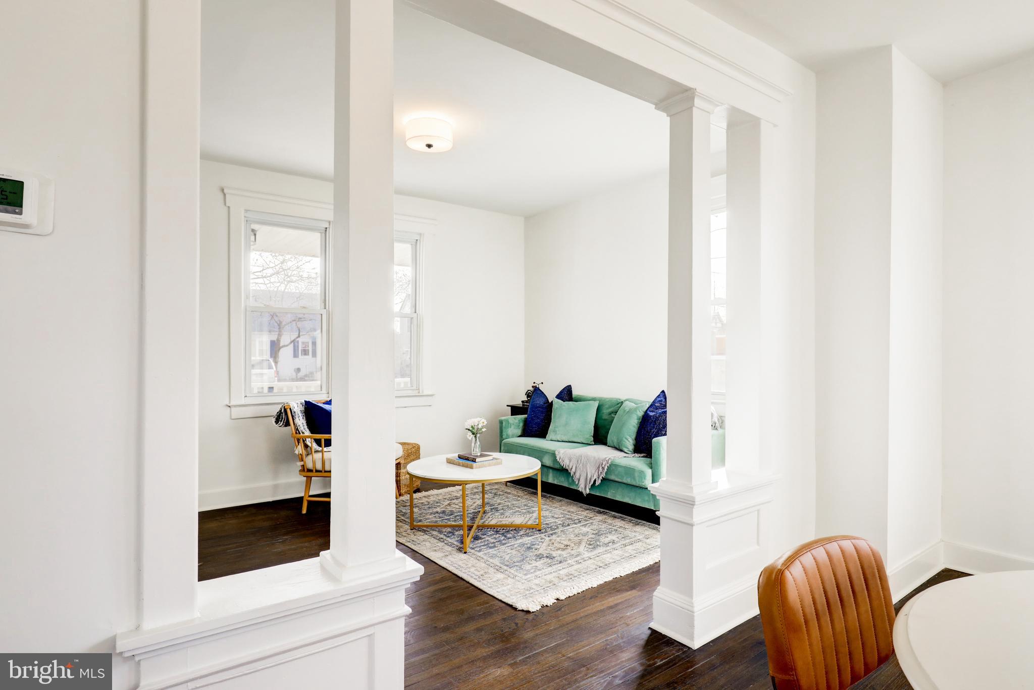 7301 North Radcliffe Street Bristol, PA 19007 - Photo 4 of 43 a living room with furniture and a potted plant