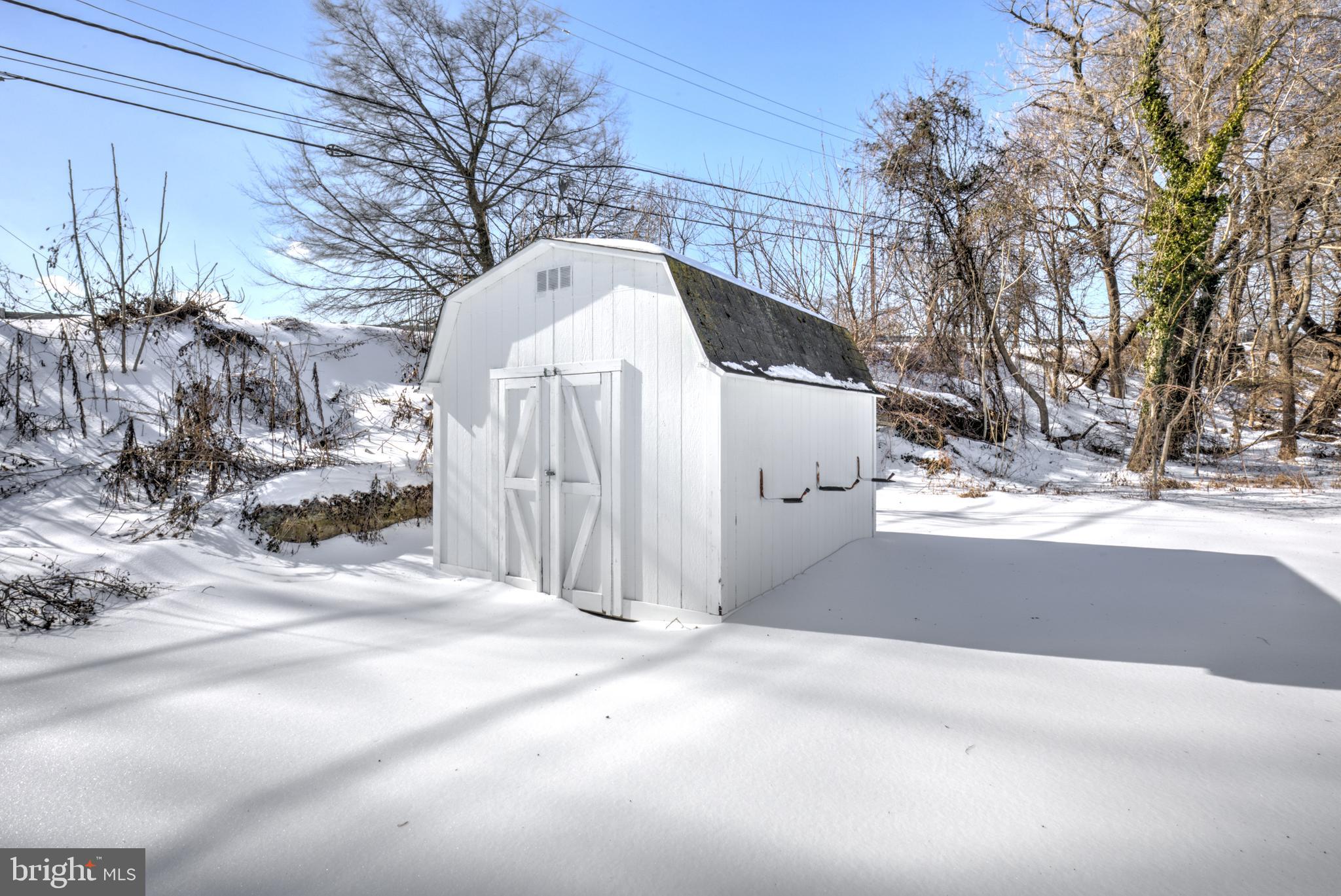 7301 North Radcliffe Street Bristol, PA 19007 - Photo 41 of 43 a view of a house with snow covered in snow