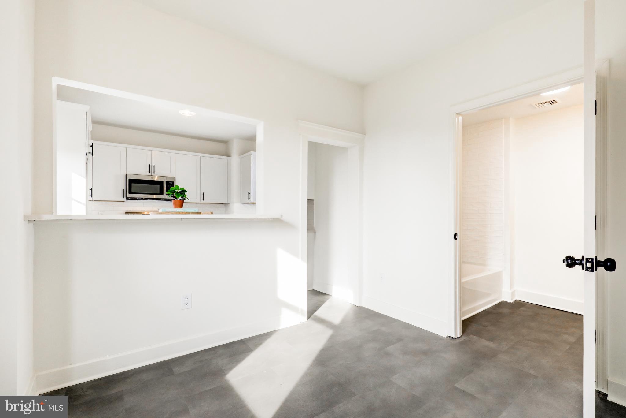 7301 North Radcliffe Street Bristol, PA 19007 - Photo 10 of 43 a view of a kitchen with microwave and cabinets