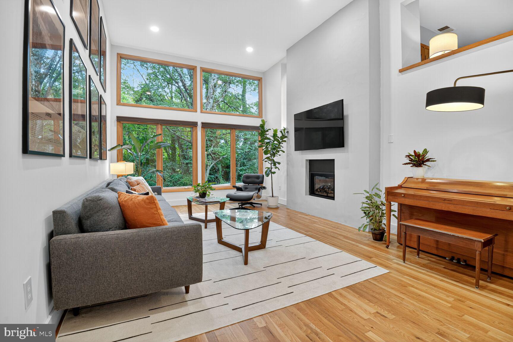 11775 Indian Ridge Road Reston, VA 20191 - Photo 11 of 29 a living room with furniture and a flat screen tv