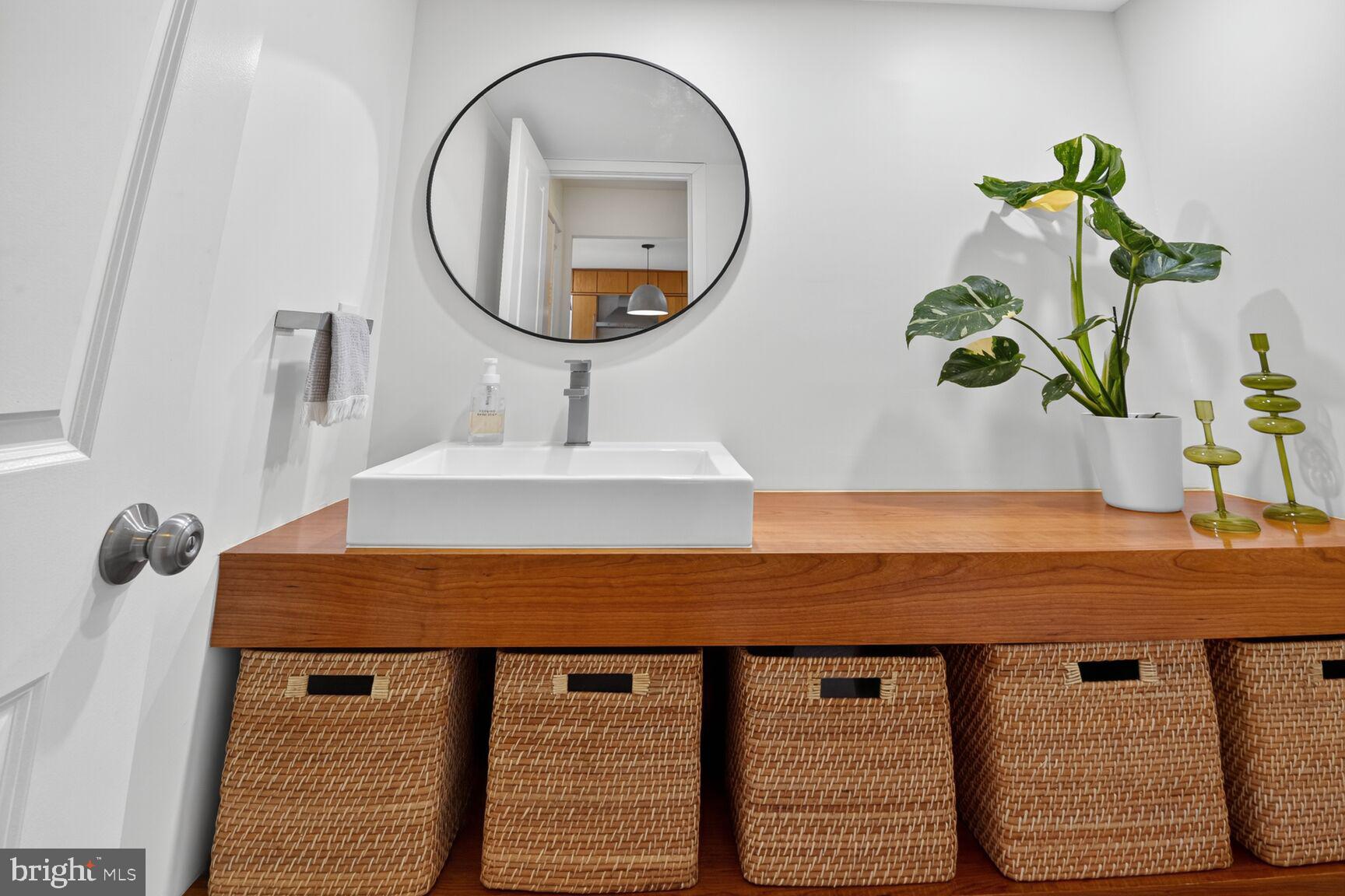 11775 Indian Ridge Road Reston, VA 20191 - Photo 13 of 29 a bathroom with a sink and a mirror