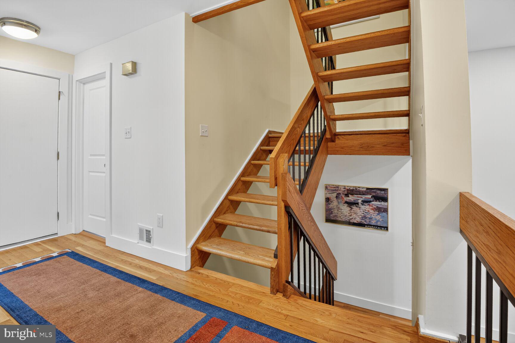 11775 Indian Ridge Road Reston, VA 20191 - Photo 14 of 29 a view of a hallway with wooden floor and staircase