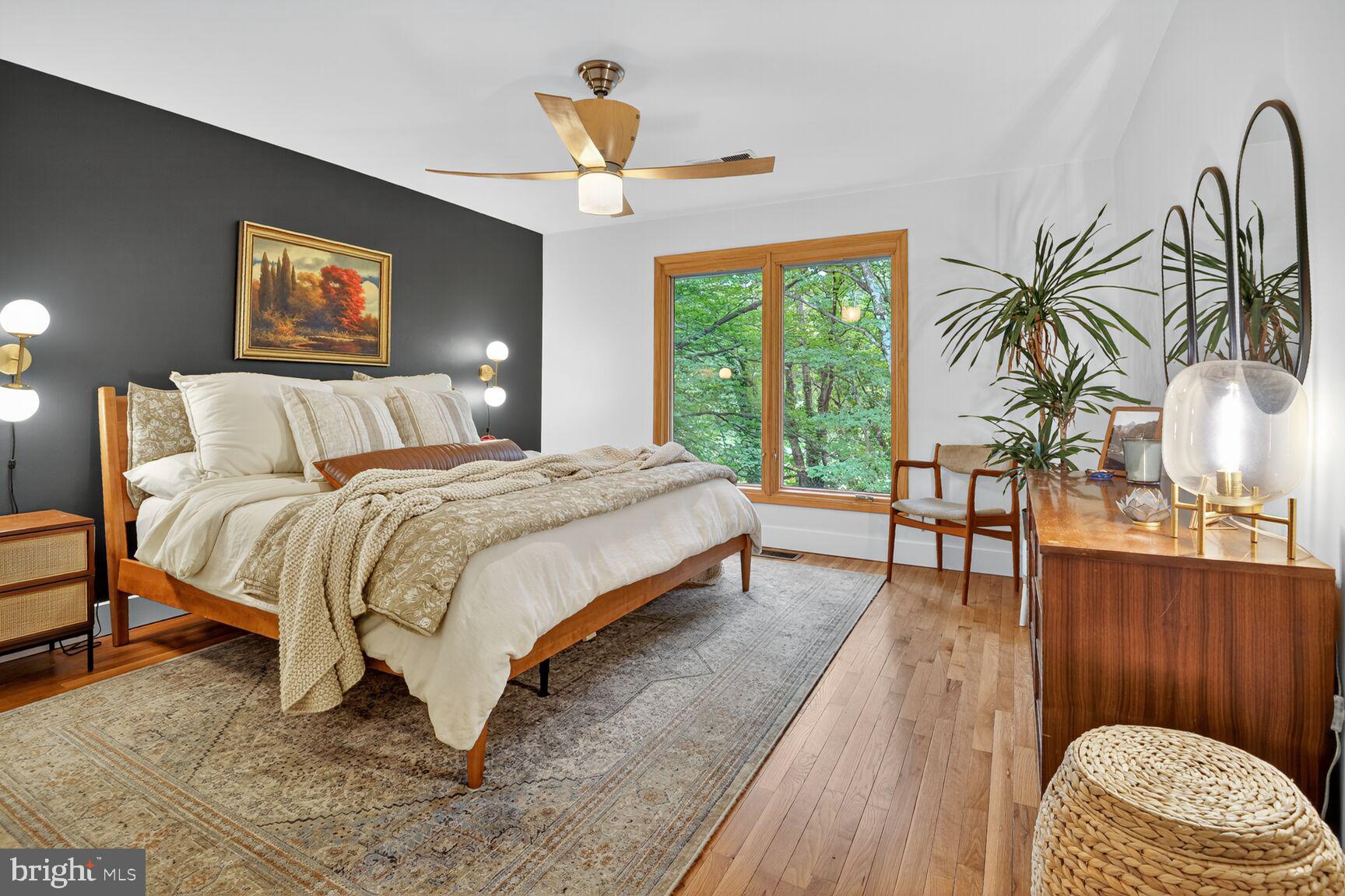 11775 Indian Ridge Road Reston, VA 20191 - Photo 15 of 29 a bedroom with a bed lamps and window