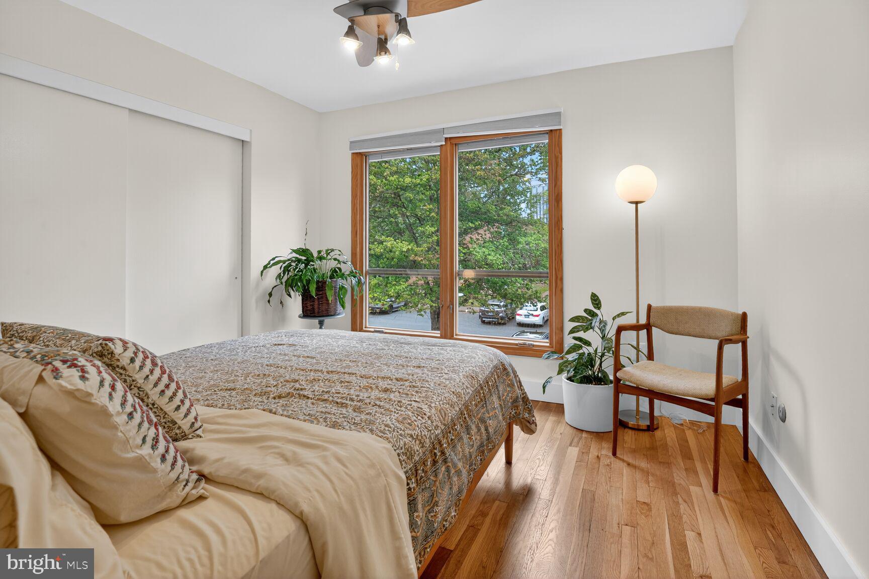 11775 Indian Ridge Road Reston, VA 20191 - Photo 17 of 29 a bedroom with a bed and large windows