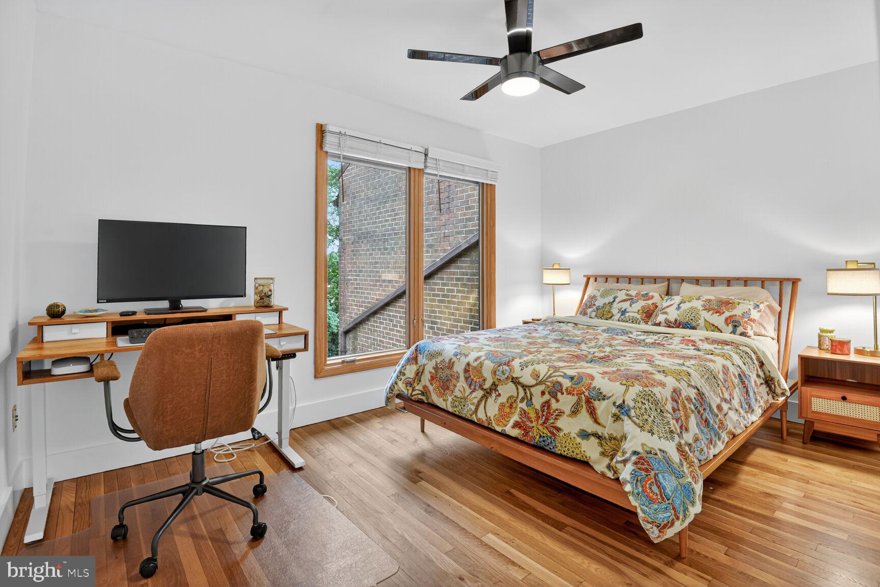 11775 Indian Ridge Road Reston, VA 20191 - Photo 19 of 29 a bedroom with a bed window and a flat screen tv