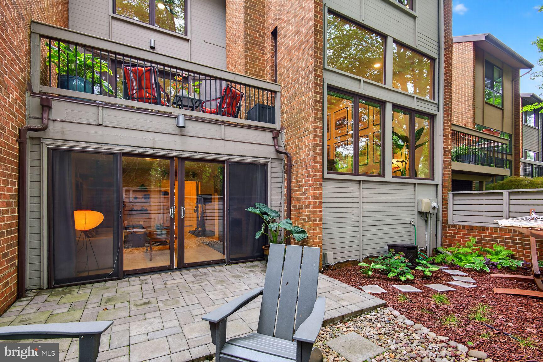 11775 Indian Ridge Road Reston, VA 20191 - Photo 25 of 29 a view of a brick house with a large windows