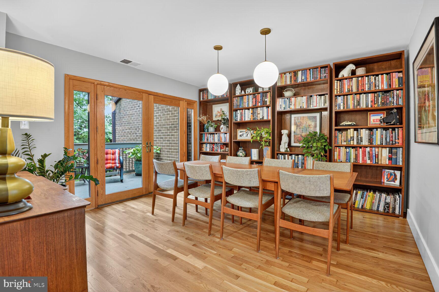11775 Indian Ridge Road Reston, VA 20191 - Photo 8 of 29 a view of a dining room with furniture a chandelier and wooden floor