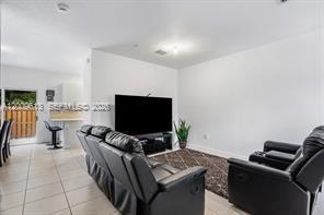 2781 Northwest 55th Way Lauderhill, FL 33313 - Photo 5 of 12 a living room with furniture and a flat screen tv