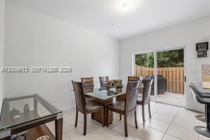 2781 Northwest 55th Way Lauderhill, FL 33313 - Photo 6 of 12 a view of a dining room with furniture and a window