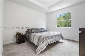 2781 Northwest 55th Way Lauderhill, FL 33313 - Photo 8 of 12 a bedroom with a bed and window