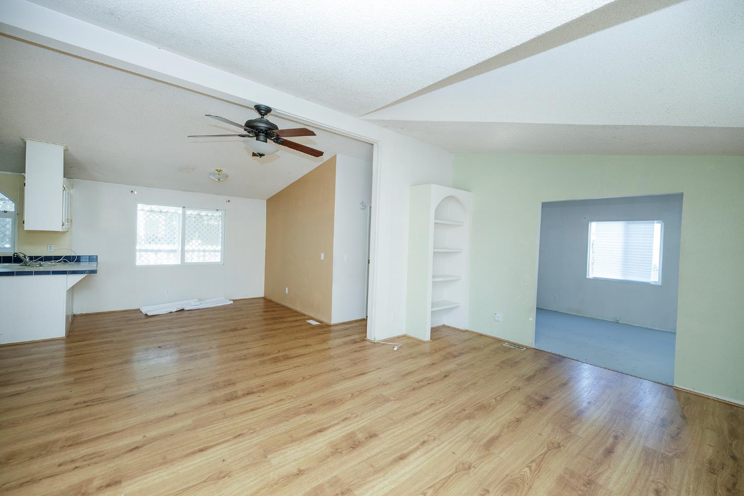 2621 Prescott Road, Unit 160 Modesto, CA 95350 - Photo 11 of 37 a view of empty room with wooden floor and fan