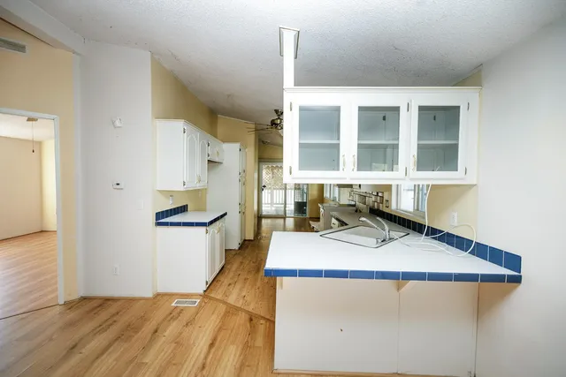 a view of a kitchen with a sink