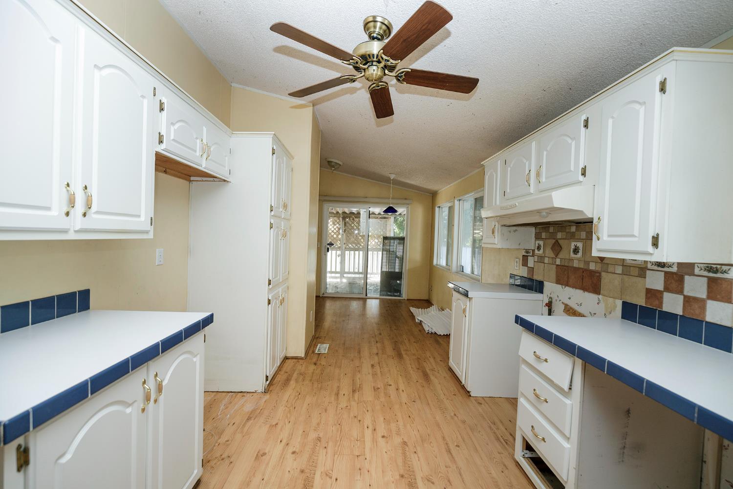 2621 Prescott Road, Unit 160 Modesto, CA 95350 - Photo 15 of 37 a kitchen with cabinets a sink and appliances
