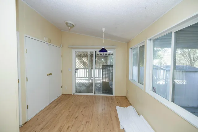 a view of entryway with wooden floor and door
