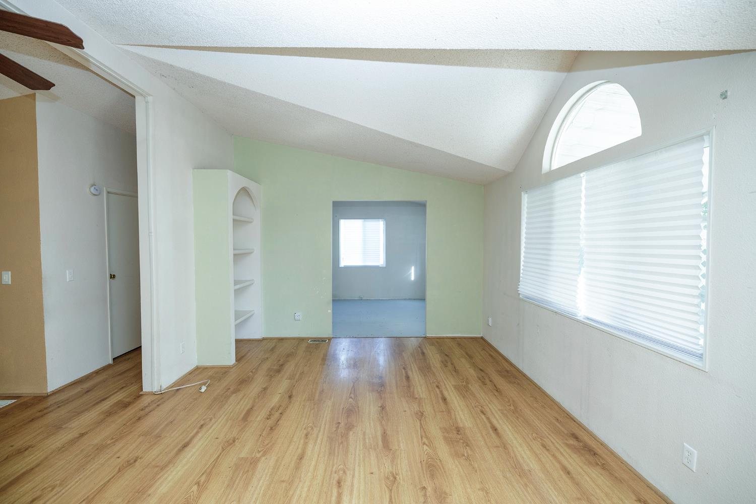 2621 Prescott Road, Unit 160 Modesto, CA 95350 - Photo 10 of 37 a view of empty room with wooden floor and fan